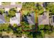 An aerial view displays the property lines of a lush, well-manicured home in a desirable neighborhood at 1173 Valley Creek Run, Winter Park, FL 32792