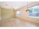 Bright dining room with tile flooring and a decorative chandelier, perfect for Gathering meals at 1173 Valley Creek Run, Winter Park, FL 32792