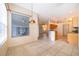 Bright living area with tile floors, pendant lighting and views of the kitchen and front door at 1173 Valley Creek Run, Winter Park, FL 32792