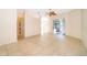 Spacious living room with tile flooring and a sliding glass door leading to the outdoor patio at 1173 Valley Creek Run, Winter Park, FL 32792