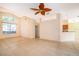 Large living room with tile floors and open access to other parts of the home at 1173 Valley Creek Run, Winter Park, FL 32792
