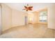 Bright and airy living room with tile flooring and large windows offering natural light at 1173 Valley Creek Run, Winter Park, FL 32792