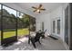 Screened porch with outdoor seating overlooking the landscaped backyard at 1173 Valley Creek Run, Winter Park, FL 32792
