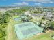Aerial view of community tennis and basketball courts, surrounded by lush landscaping at 1191 Honey Blossom Dr # D, Orlando, FL 32824