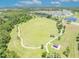 Aerial view of the community park with walking trails, playground, and open field at 1191 Honey Blossom Dr # D, Orlando, FL 32824