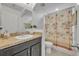 Bathroom with a vanity and shower with a tropical-themed curtain at 1191 Honey Blossom Dr # D, Orlando, FL 32824