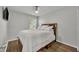 Neutral bedroom with wood floors, ceiling fan, and a window for natural light at 1191 Honey Blossom Dr # D, Orlando, FL 32824