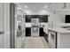 Modern kitchen with stainless steel appliances, granite countertops, and ample cabinet space at 1191 Honey Blossom Dr # D, Orlando, FL 32824