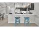 Bright kitchen with granite countertops and stainless appliances and breakfast bar at 1191 Honey Blossom Dr # D, Orlando, FL 32824
