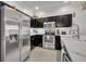 Well-equipped kitchen featuring stainless steel appliances and marble countertops at 1191 Honey Blossom Dr # D, Orlando, FL 32824