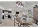 Open-concept living space featuring tile floors, neutral paint, and access to the kitchen at 1191 Honey Blossom Dr # D, Orlando, FL 32824