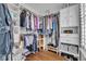 Walk-in closet features custom shelving, ample storage space, and organized display for shoes and accessories at 1191 Honey Blossom Dr # D, Orlando, FL 32824