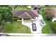 Spacious backyard with lush greenery and a detached garage at 12207 Florida Woods Ln, Orlando, FL 32824