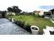 View of the backyard garden with a variety of potted plants and greenery at 12207 Florida Woods Ln, Orlando, FL 32824