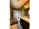 A bathroom featuring a tub with shower, granite countertop, and tile floors at 12207 Florida Woods Ln, Orlando, FL 32824