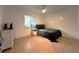 Bedroom with a single bed, a window, tiled floors, and a white dresser at 12207 Florida Woods Ln, Orlando, FL 32824