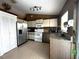Functional kitchen featuring stainless steel appliances and plenty of counter space at 12207 Florida Woods Ln, Orlando, FL 32824