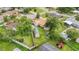 Aerial view of a home with a fenced yard, a shed, and backyard area at 14157 Louisville Ct, Orlando, FL 32826