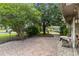 Spacious brick patio area surrounded by lush greenery and landscaping, perfect for outdoor relaxation at 14157 Louisville Ct, Orlando, FL 32826
