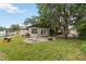 Backyard with brick patio and lush lawn at 14157 Louisville Ct, Orlando, FL 32826