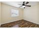 Well-lit bedroom features wood-look flooring and a ceiling fan at 14157 Louisville Ct, Orlando, FL 32826