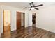 Charming bedroom boasts unique flooring, a closet, and access to the bathroom at 14157 Louisville Ct, Orlando, FL 32826