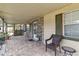 Inviting covered front porch with brick accents and comfortable seating at 14157 Louisville Ct, Orlando, FL 32826