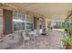 Inviting brick front porch with seating and decorative plants at 14157 Louisville Ct, Orlando, FL 32826