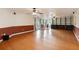 Large living room with wood floors, built-in shelves, and natural light from the french doors at 14157 Louisville Ct, Orlando, FL 32826