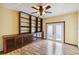 Bright living room boasts ample shelving and double doors at 14157 Louisville Ct, Orlando, FL 32826
