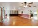 Open living room showcasing built-in shelving, natural light, and seamless flow to the kitchen at 14157 Louisville Ct, Orlando, FL 32826