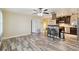 Spacious living area with open access to the modern kitchen and breakfast bar at 14157 Louisville Ct, Orlando, FL 32826