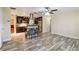 Open living space with modern flooring flowing into a stylish kitchen at 14157 Louisville Ct, Orlando, FL 32826