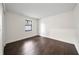 Simple bedroom with hardwood floors and a window providing natural light at 1523 N Beach St, Ormond Beach, FL 32174