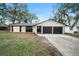 Charming renovated home with a two-car garage and a well-manicured lawn at 1523 N Beach St, Ormond Beach, FL 32174