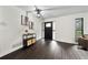 Bright foyer features dark wood floors, a modern light fixture, and stylish decorations at 1523 N Beach St, Ormond Beach, FL 32174