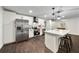 Stylish kitchen features stainless steel appliances, a center island, and updated cabinetry at 1523 N Beach St, Ormond Beach, FL 32174