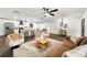 Inviting living area featuring modern furniture, an open kitchen, and ample natural light at 1523 N Beach St, Ormond Beach, FL 32174