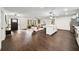 Spacious open-concept living room with wood floors, lots of seating, and natural light at 1523 N Beach St, Ormond Beach, FL 32174