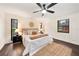 Comfortable main bedroom with a ceiling fan, dark wood floors, and stylish decor at 1523 N Beach St, Ormond Beach, FL 32174
