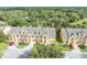 Aerial view of townhomes showing lush greenery and a serene neighborhood setting, offering a tranquil living environment at 1534 Barking Deer Cv, Casselberry, FL 32707