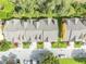 Top-down aerial of townhomes showing lush landscaping and convenient parking, offering vibrant community living at 1534 Barking Deer Cv, Casselberry, FL 32707