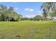Lush backyard features mature trees providing ample shade and enhanced privacy at 1534 Barking Deer Cv, Casselberry, FL 32707