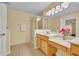 Bathroom showcasing a modern vanity, glass-enclosed shower, and contemporary lighting fixtures at 1534 Barking Deer Cv, Casselberry, FL 32707