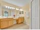 Bright bathroom featuring double sinks, ample counter space, and a neutral color scheme at 1534 Barking Deer Cv, Casselberry, FL 32707