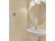 Bathroom featuring a pedestal sink, framed mirror, and chrome fixtures at 1534 Barking Deer Cv, Casselberry, FL 32707