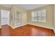 Well-lit bedroom with hardwood floors, a door to a balcony, and a walk-in closet at 1534 Barking Deer Cv, Casselberry, FL 32707