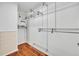 Walk-in closet with custom shelving and rods for optimal storage solutions at 1534 Barking Deer Cv, Casselberry, FL 32707