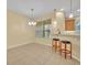 Bright dining area with breakfast bar with pendant lighting, and a view of the kitchen at 1534 Barking Deer Cv, Casselberry, FL 32707