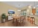 Dining area with breakfast bar and access to the kitchen offering modern design at 1534 Barking Deer Cv, Casselberry, FL 32707